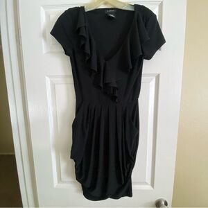 B. Smart Black Dress with Ruffles and Pockets